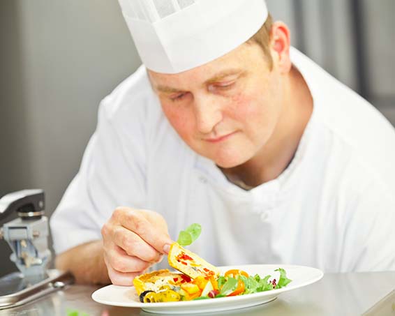 Chef Finishing Off Dinner Plate
