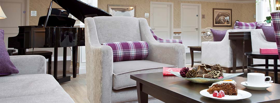Armchairs and coffee table in reception at Beaumont Manor Care Home