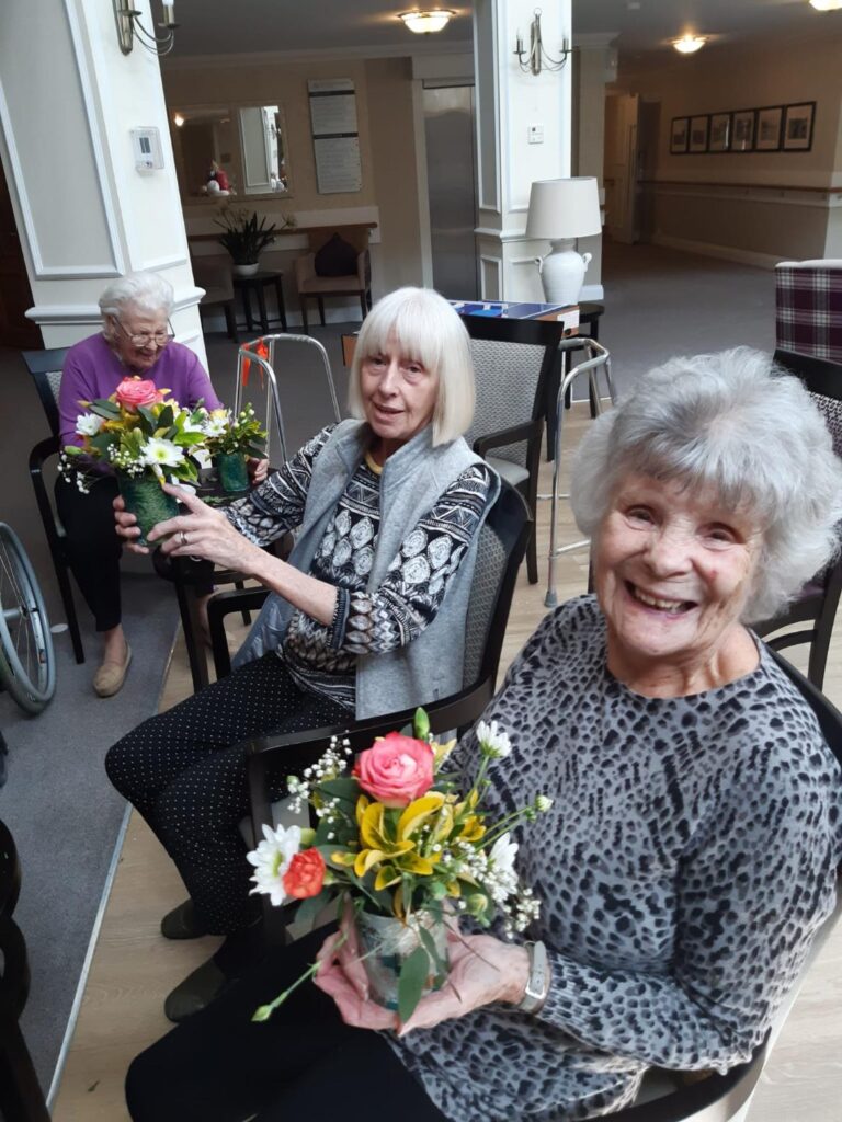 residents doing flower arranging