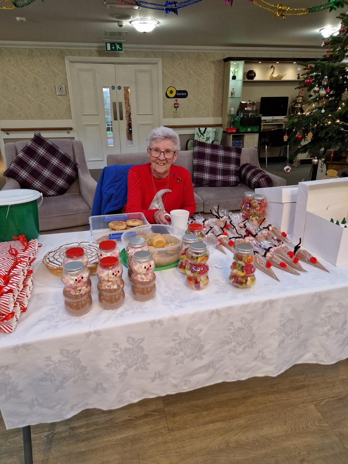 resident with a table full of treats on our fete